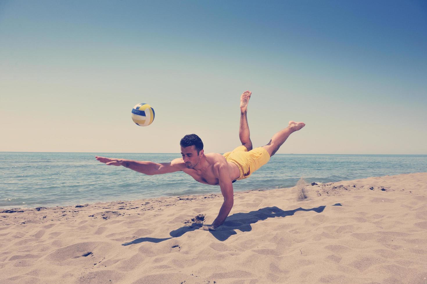 male beach volleyball game player photo