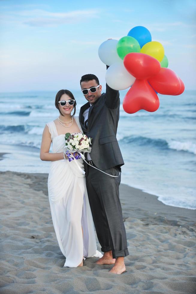 romantic beach wedding at sunset photo