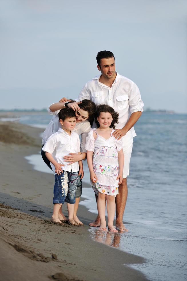 happy young family have fun on beach photo