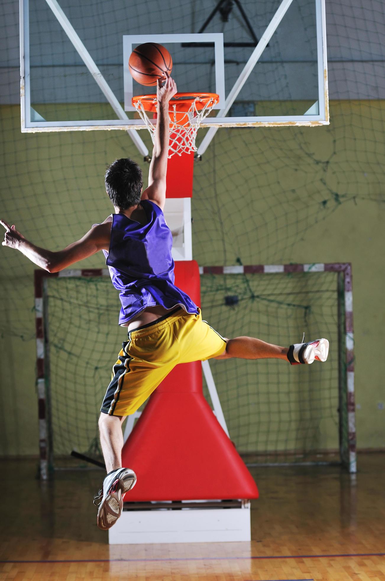 basket ball game player at sport hall 12645286 Stock Photo at Vecteezy