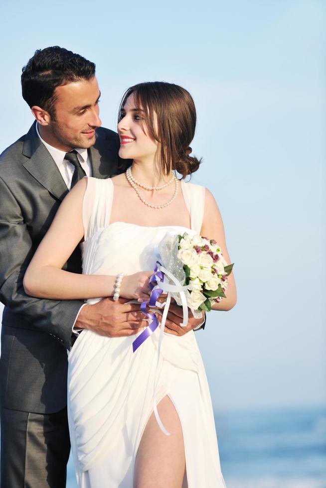 romantic beach wedding at sunset photo