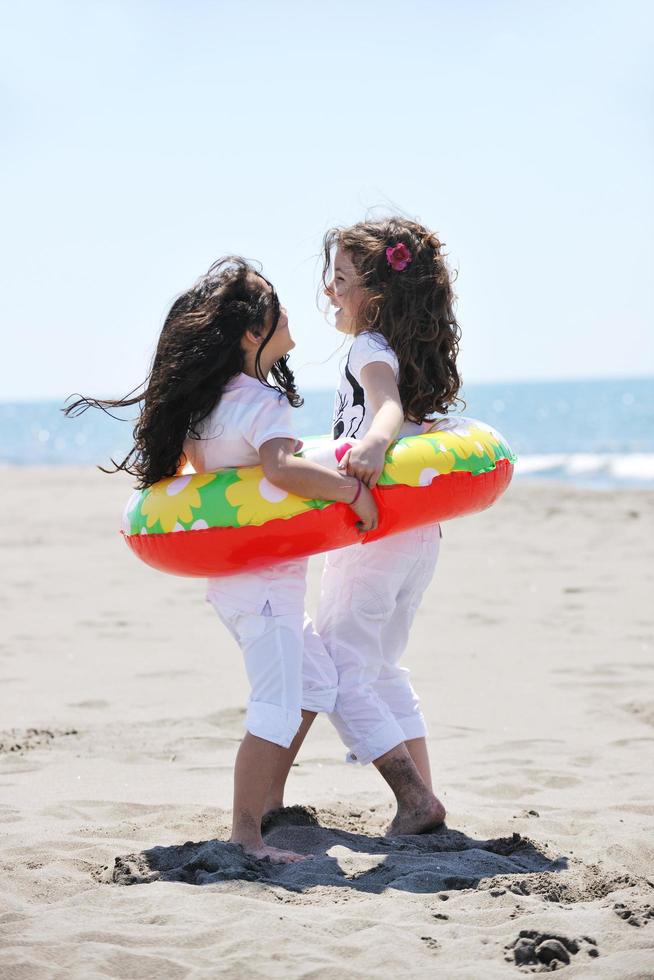 happy young  people group have fun on beach photo