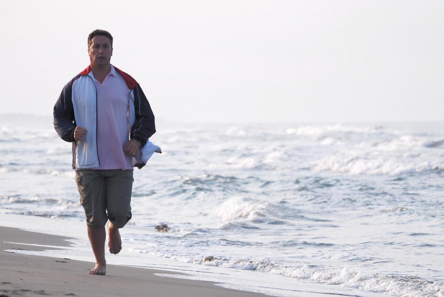 Runner on beach photo