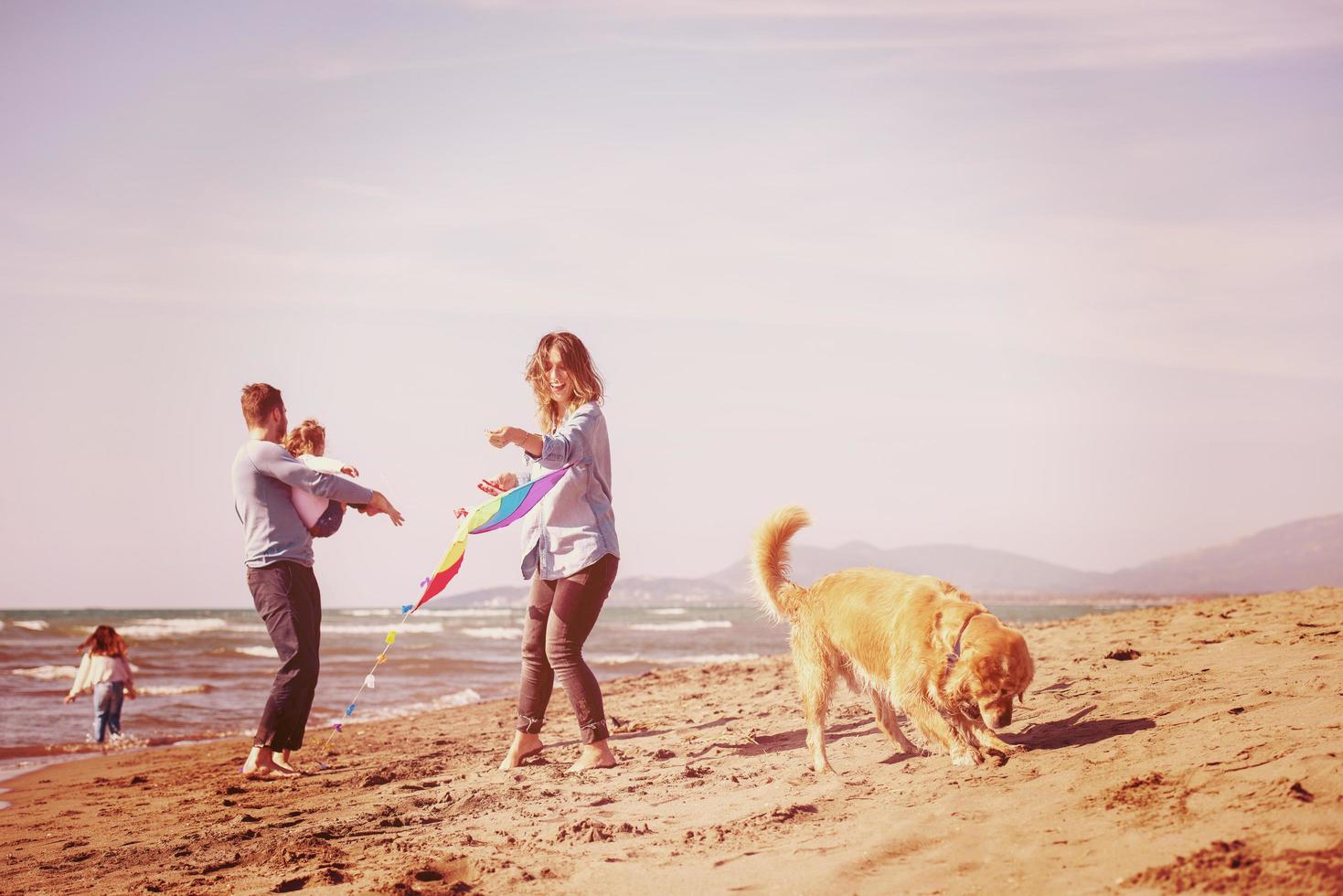 happy young family enjoying vecation during autumn day photo