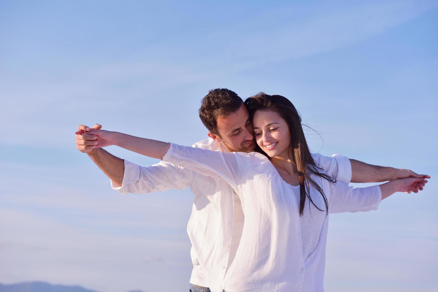 young couple  on beach have fun photo