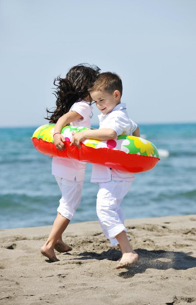 happy young  people group have fun on beach photo