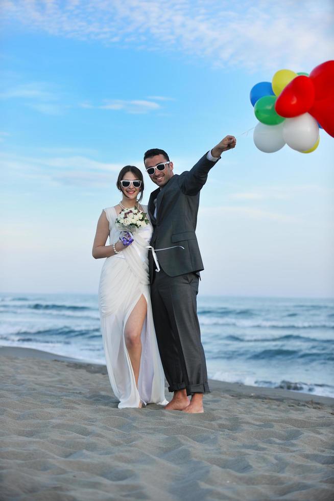 romantic beach wedding at sunset photo