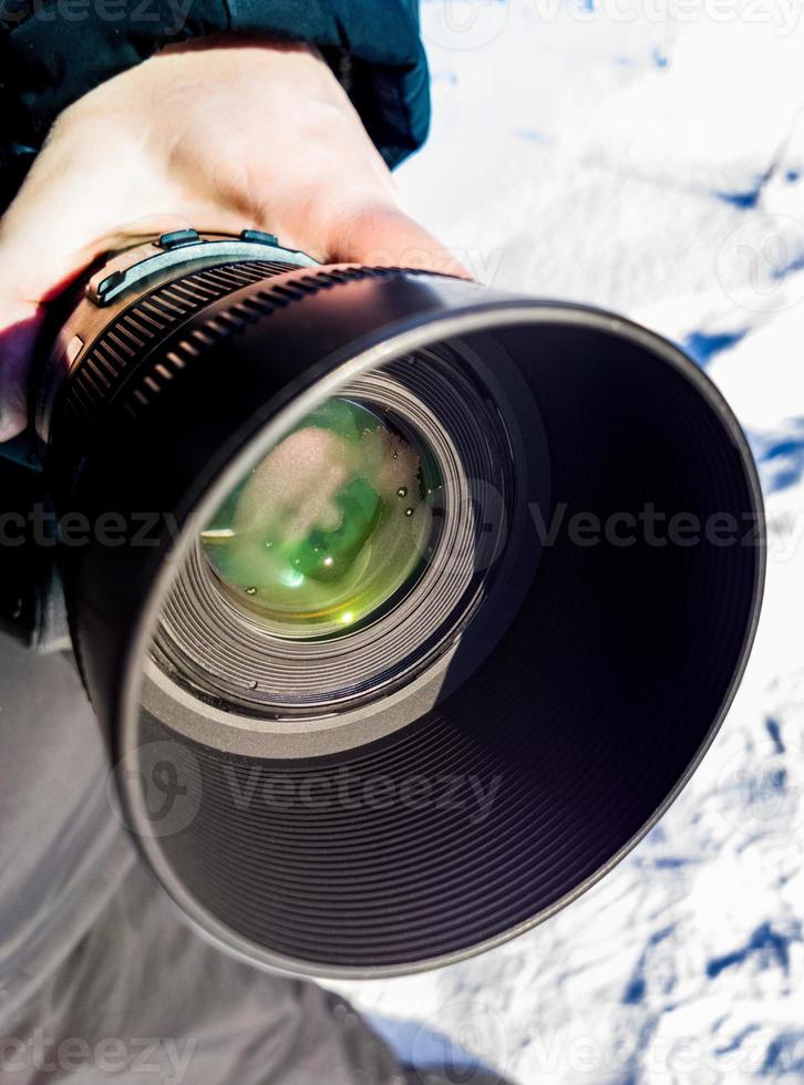 sweating telephoto dslr camera lens at winter morning photo