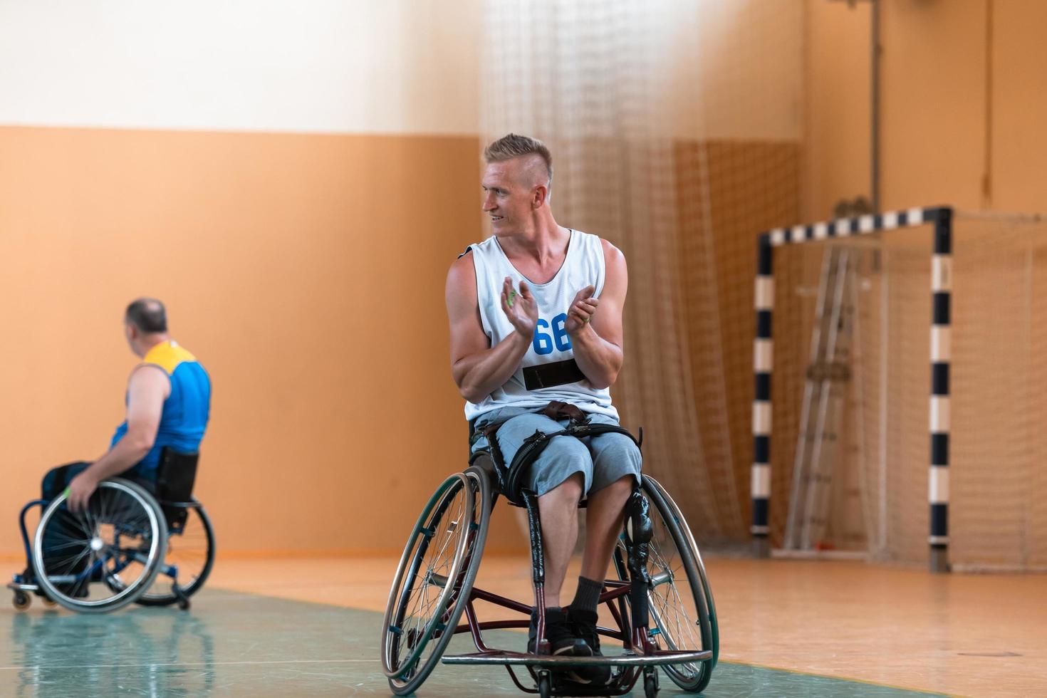 a basketball player with a disability celebrates winning points in a game in the arena photo