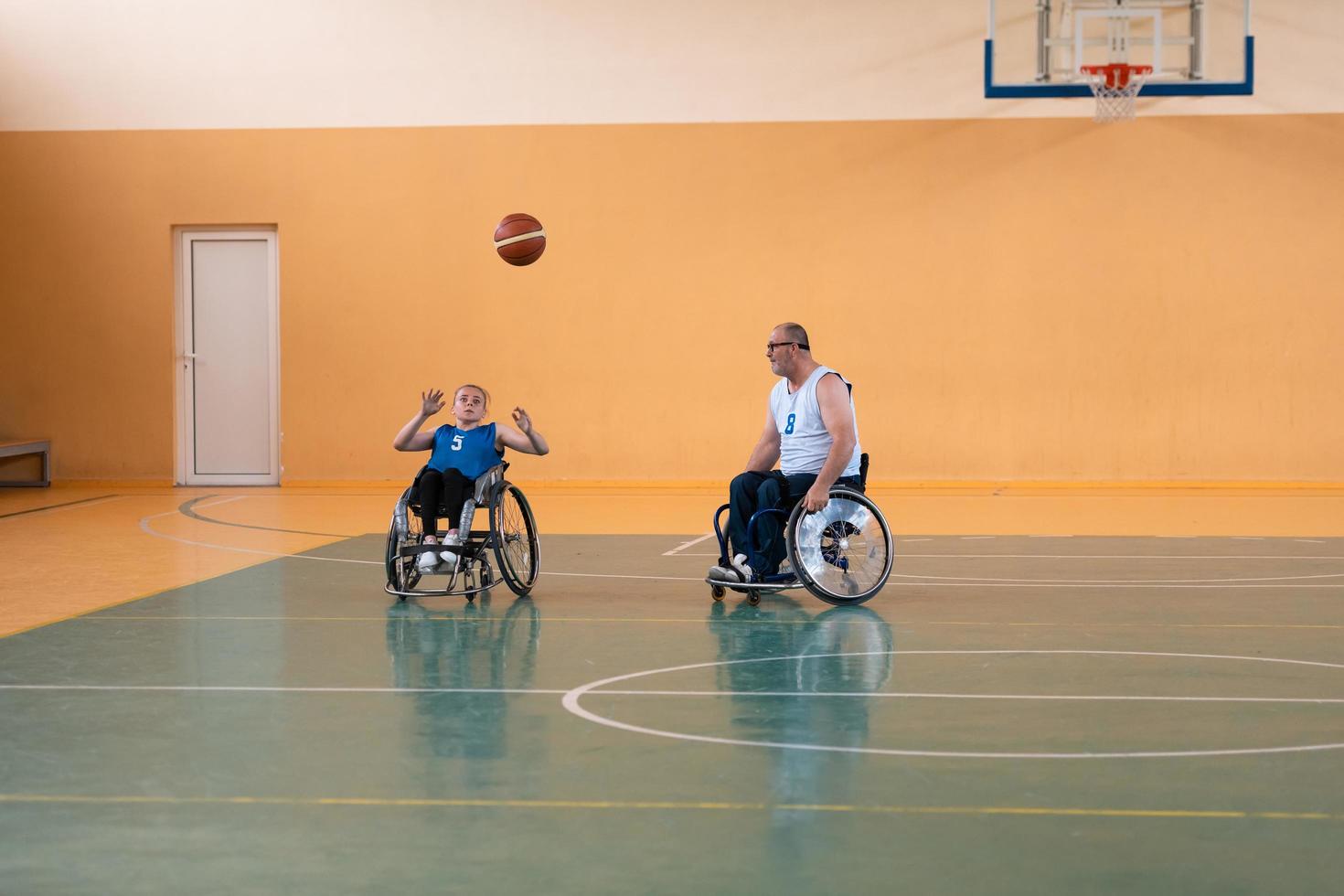 a young woman playing wheelchair basketball in a professional team. Gender equality, the concept of sports with disabilities. photo