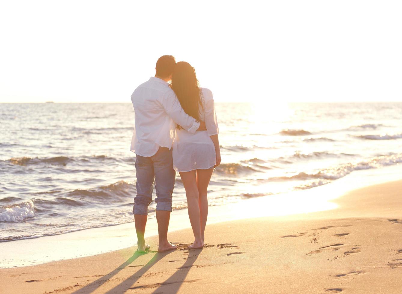 young couple  on beach have fun photo