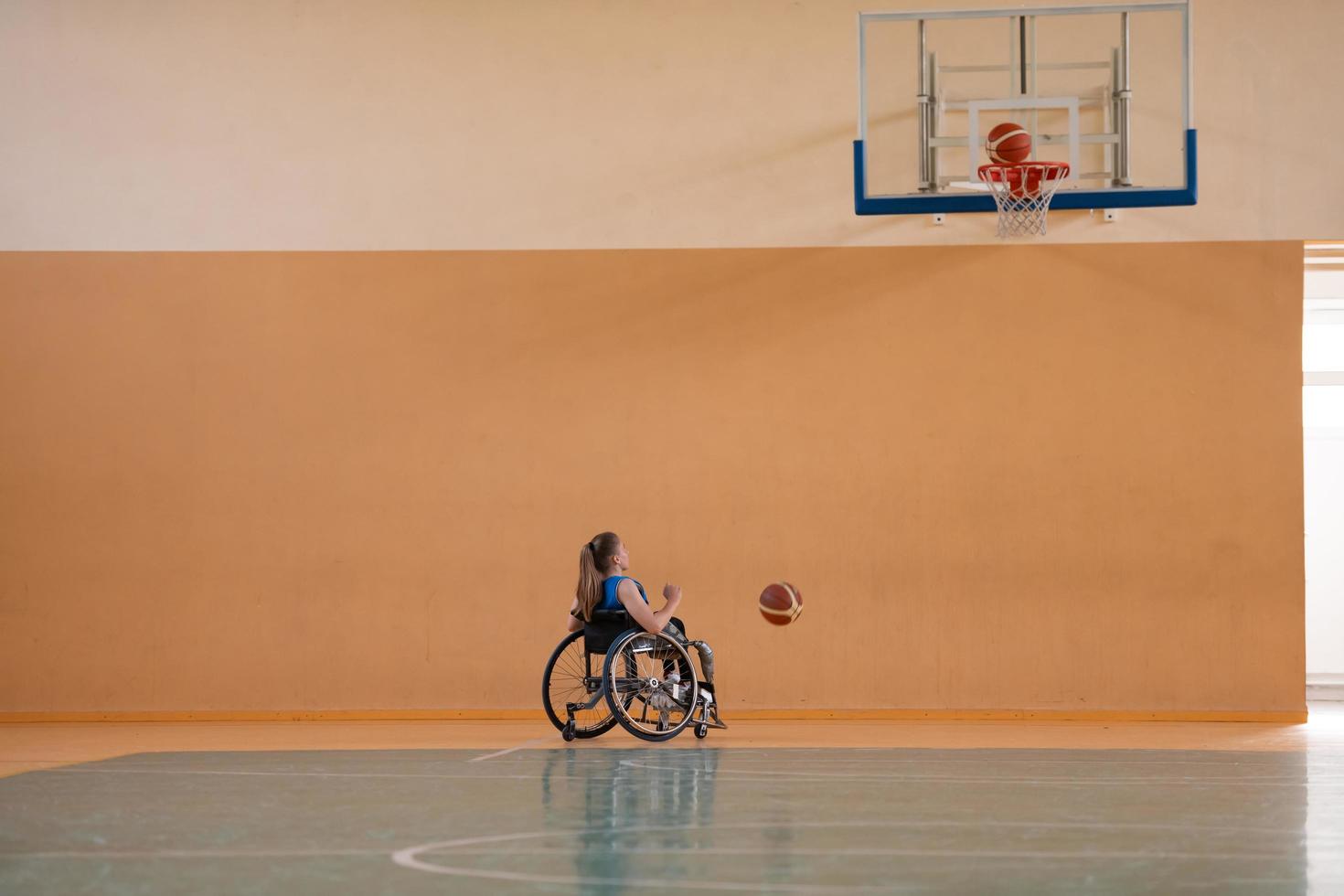 photo of the basketball team of war invalids with professional sports equipment for people with disabilities on the basketball court