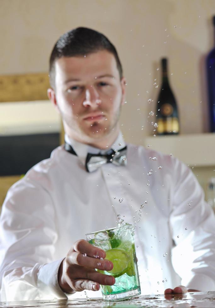 pro barman prepare coctail drink on party photo