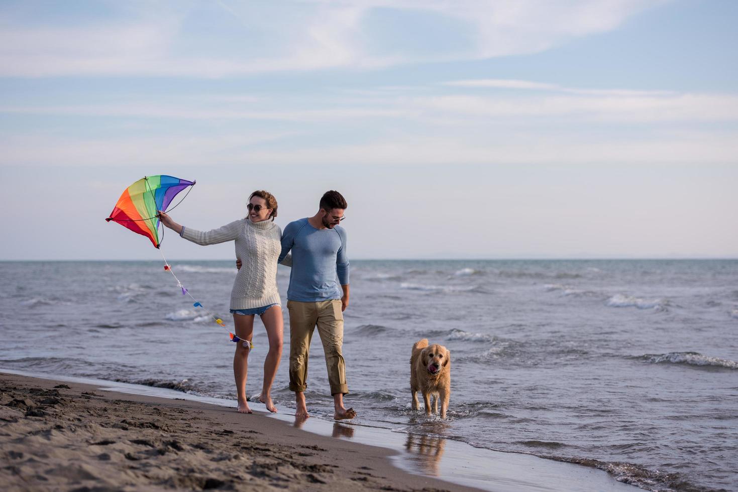 happy couple enjoying time together at beach photo