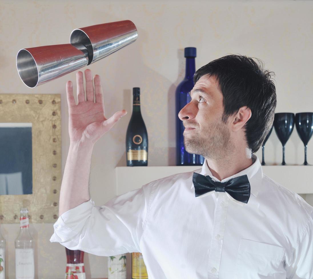 pro barman prepare coctail drink on party photo