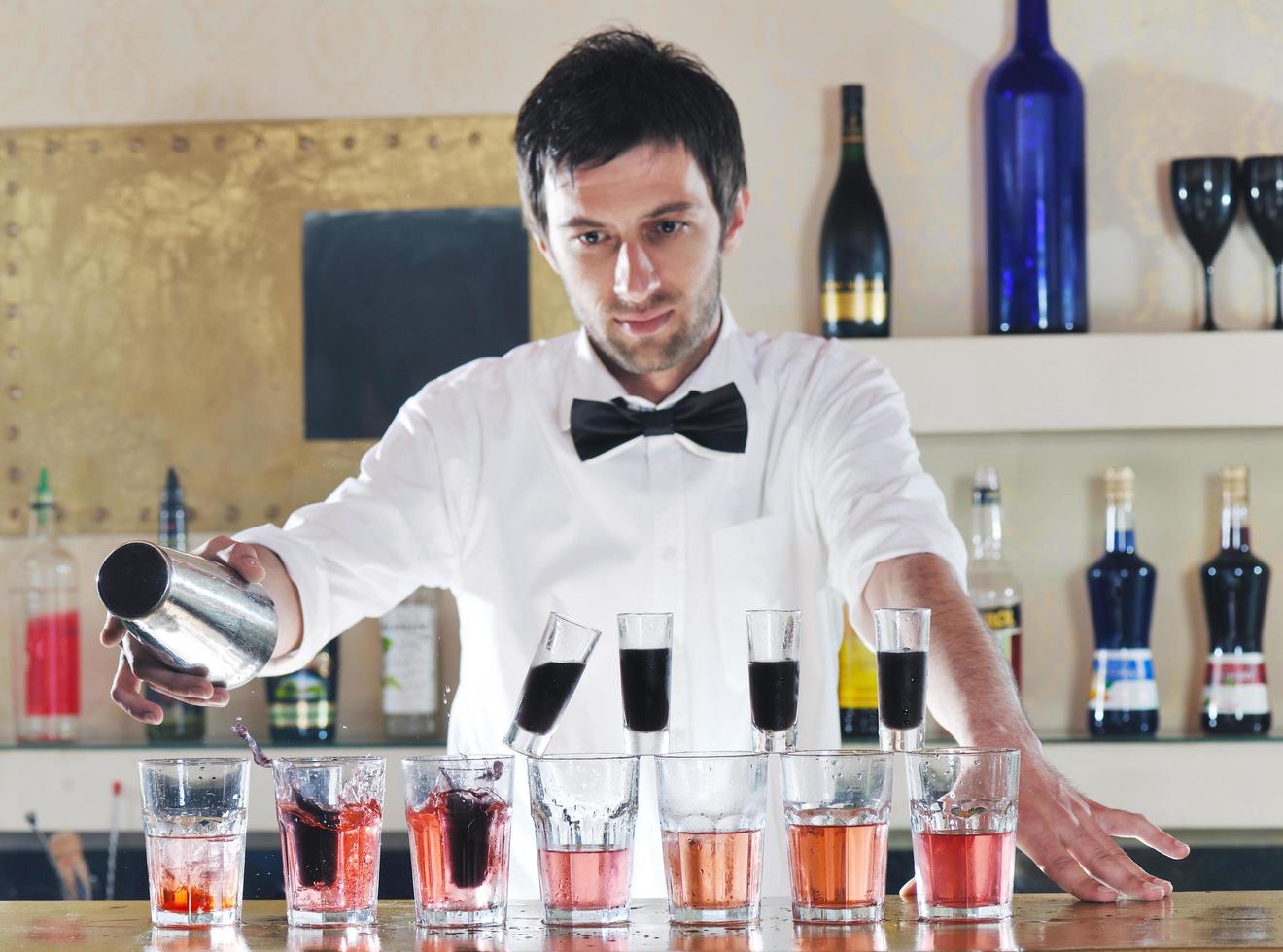 pro barman prepare coctail drink on party photo