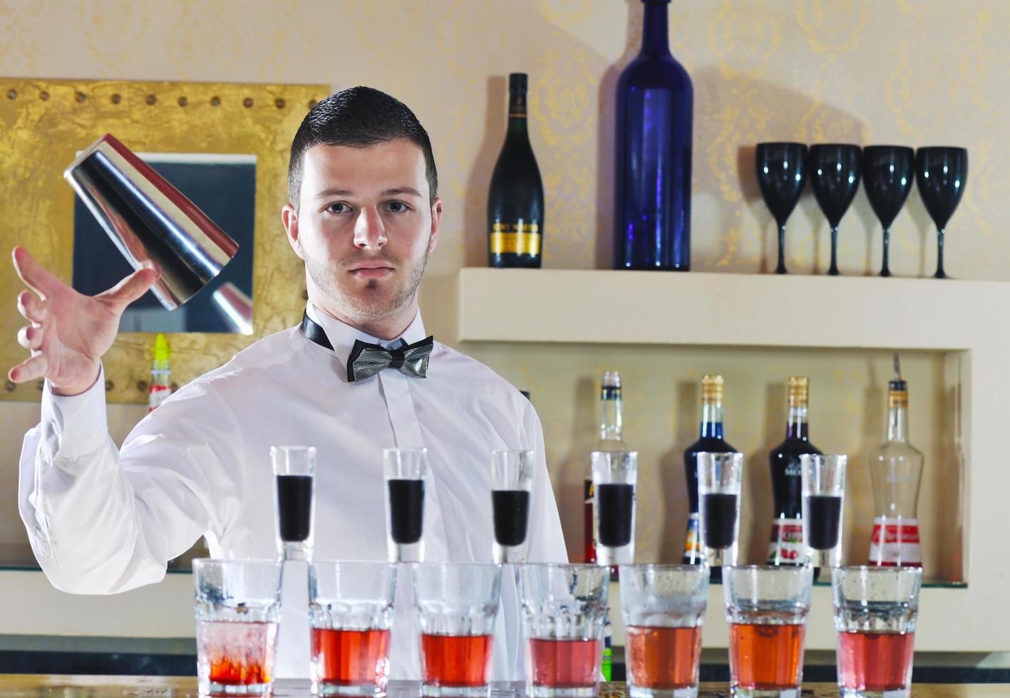 pro barman prepare coctail drink on party photo