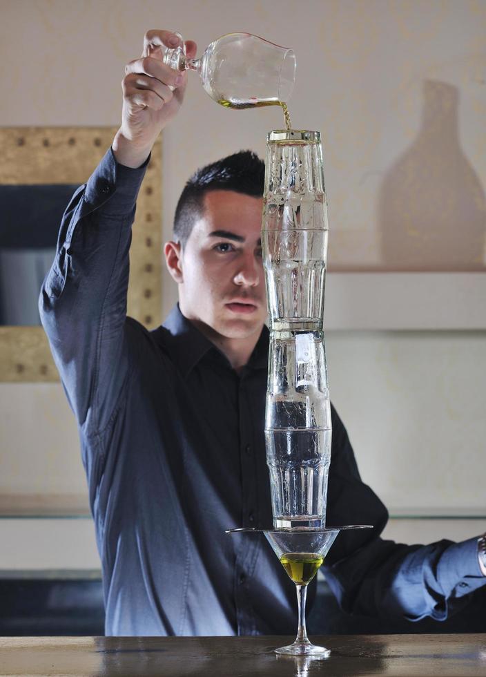 pro barman prepare coctail drink on party photo