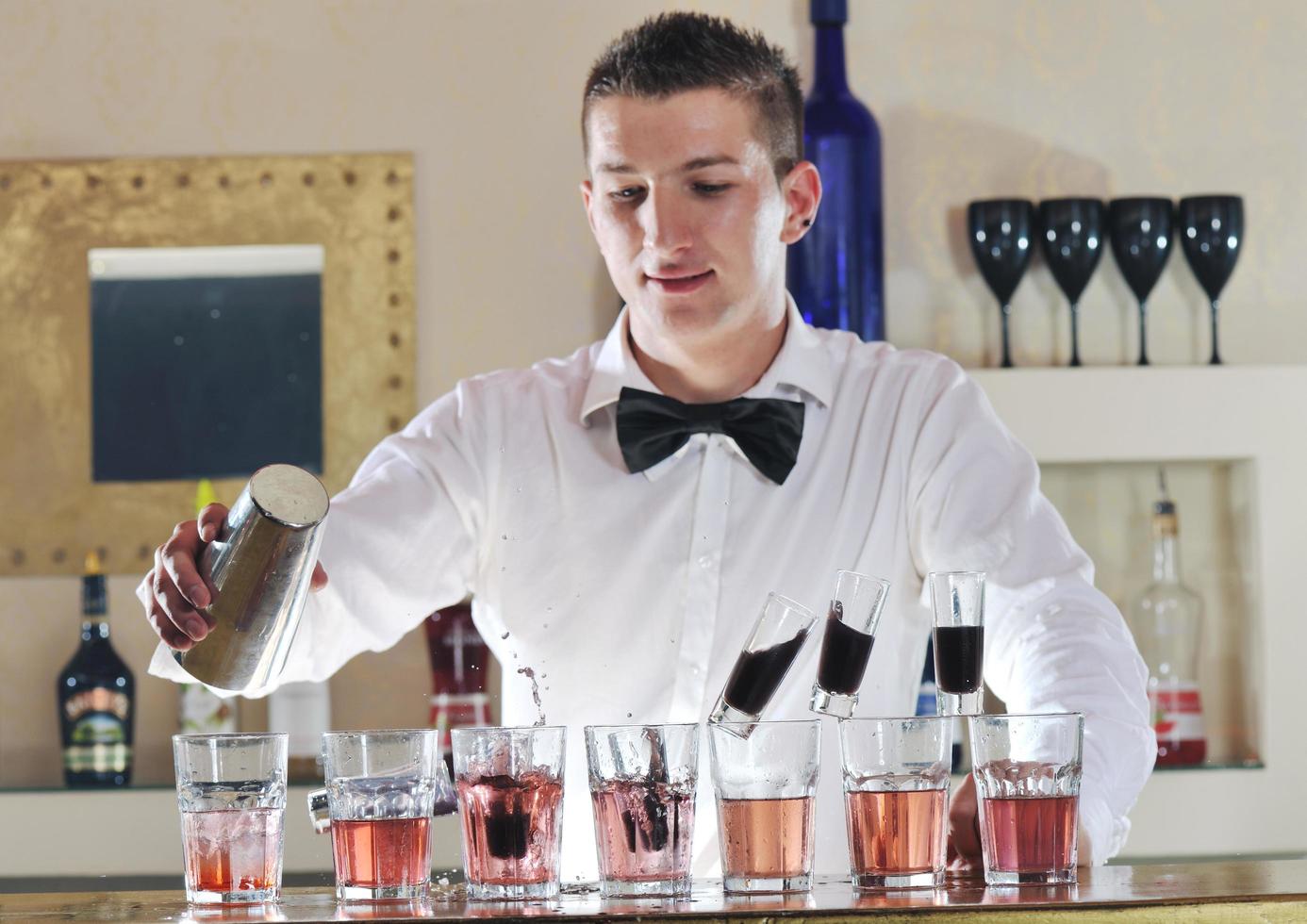 pro barman prepare coctail drink on party photo