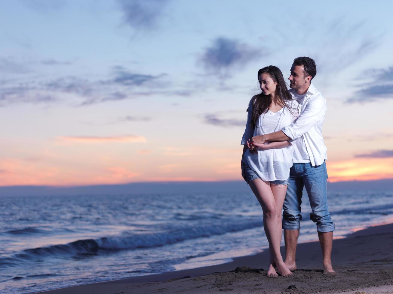 young couple  on beach have fun photo