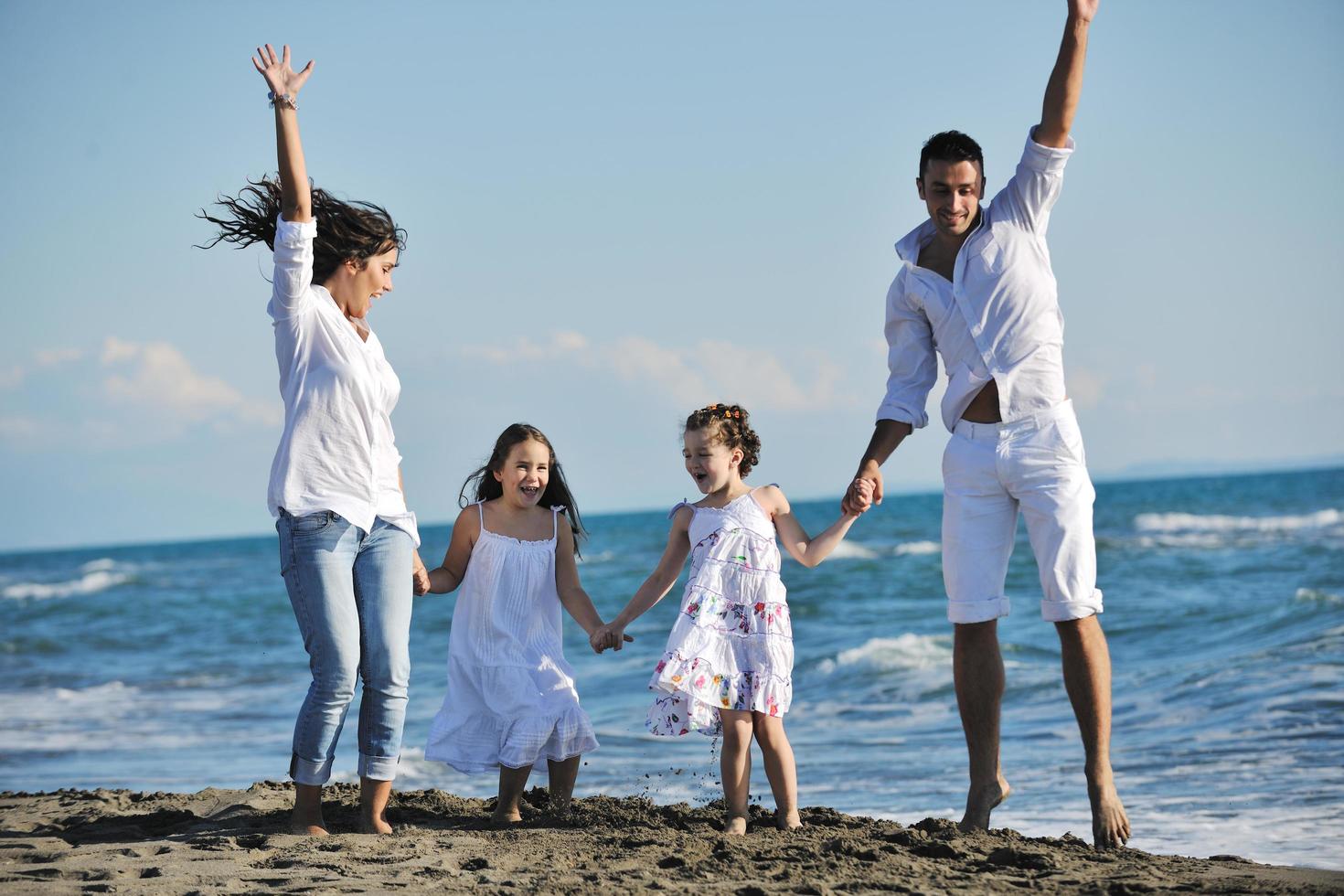 happy young  family have fun on beach photo