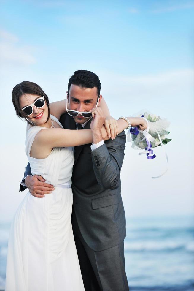 romantic beach wedding at sunset photo