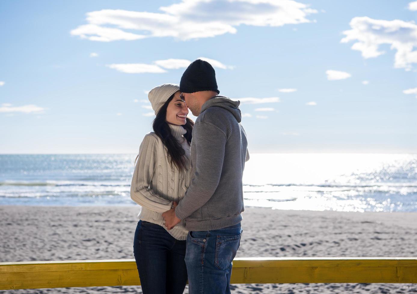 Couple chating and having fun at beach bar photo