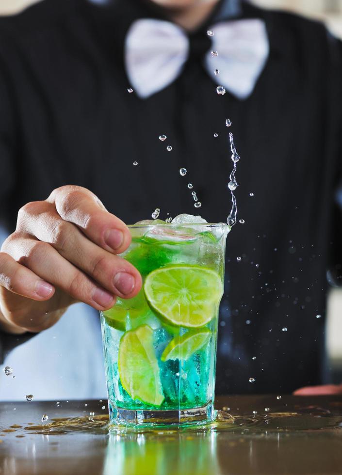 pro barman prepare coctail drink on party photo