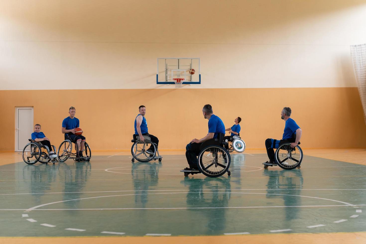 training of the basketball team of war invalids with professional sports equipment for people with disabilities on the basketball court photo