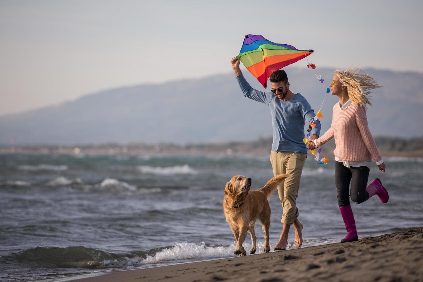 happy couple enjoying time together at beach photo