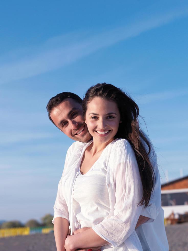 young couple  on beach have fun photo