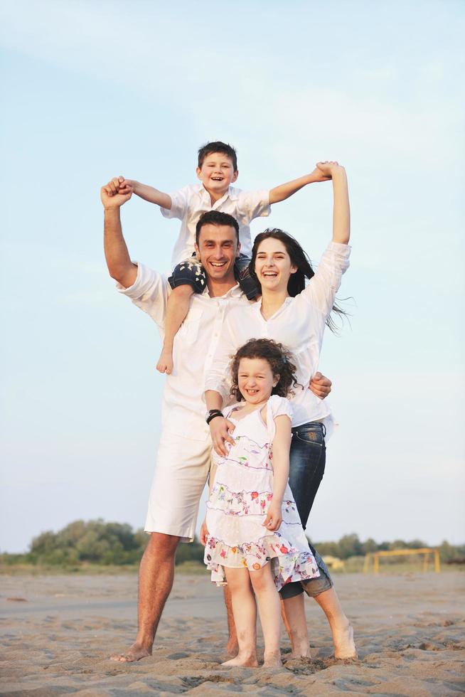 happy young family have fun on beach photo