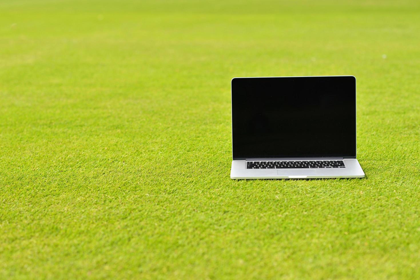 laptop computer  on grass photo