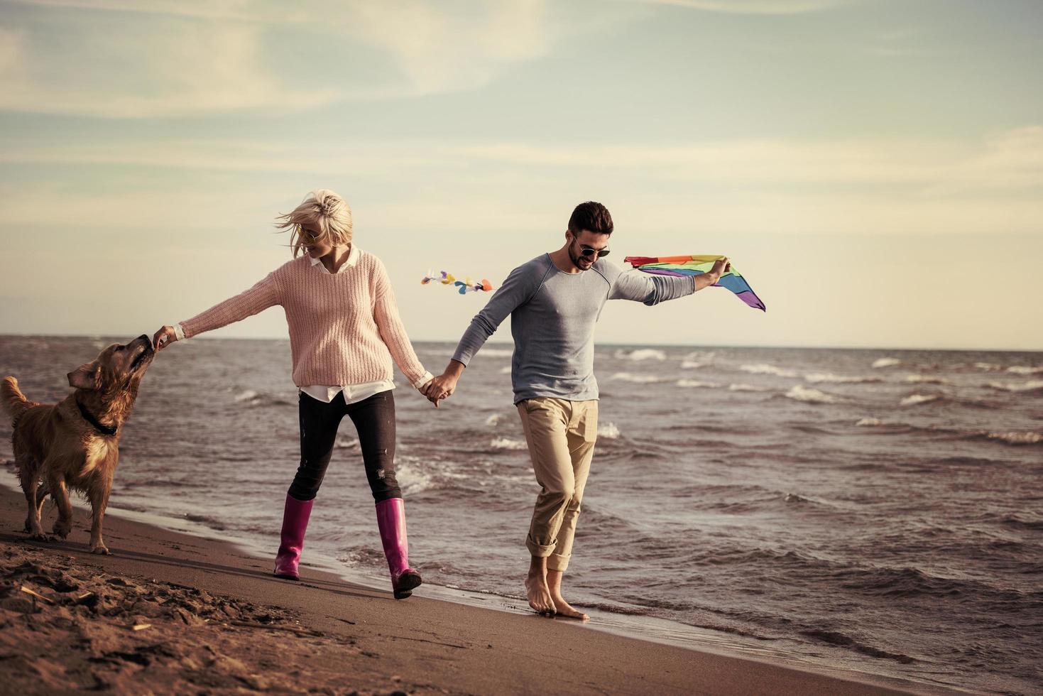 happy couple enjoying time together at beach photo