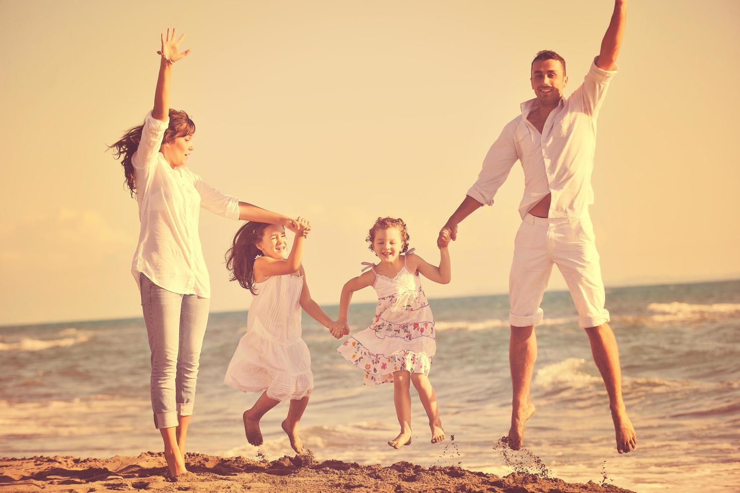 happy young  family have fun on beach photo