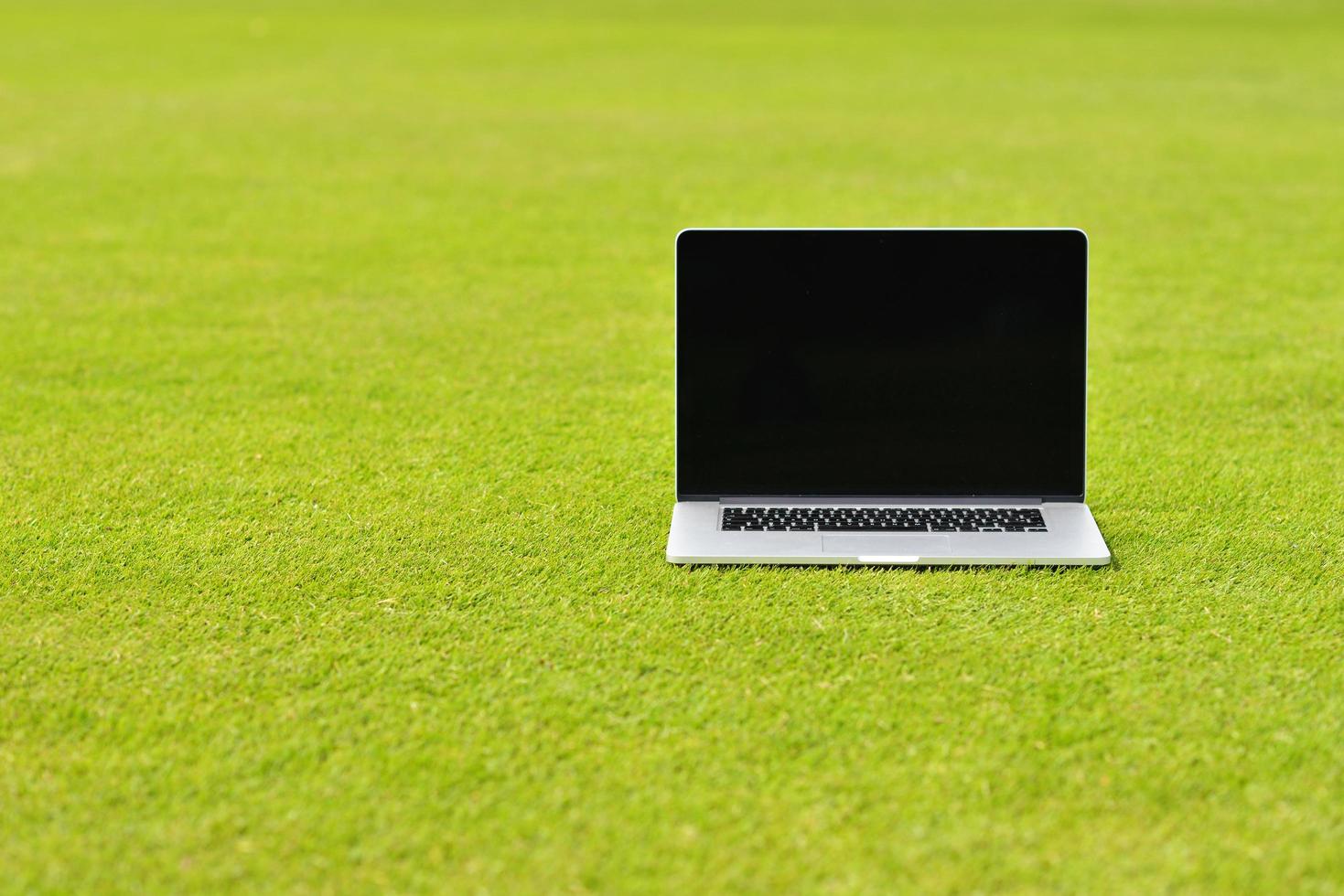 laptop computer  on grass photo