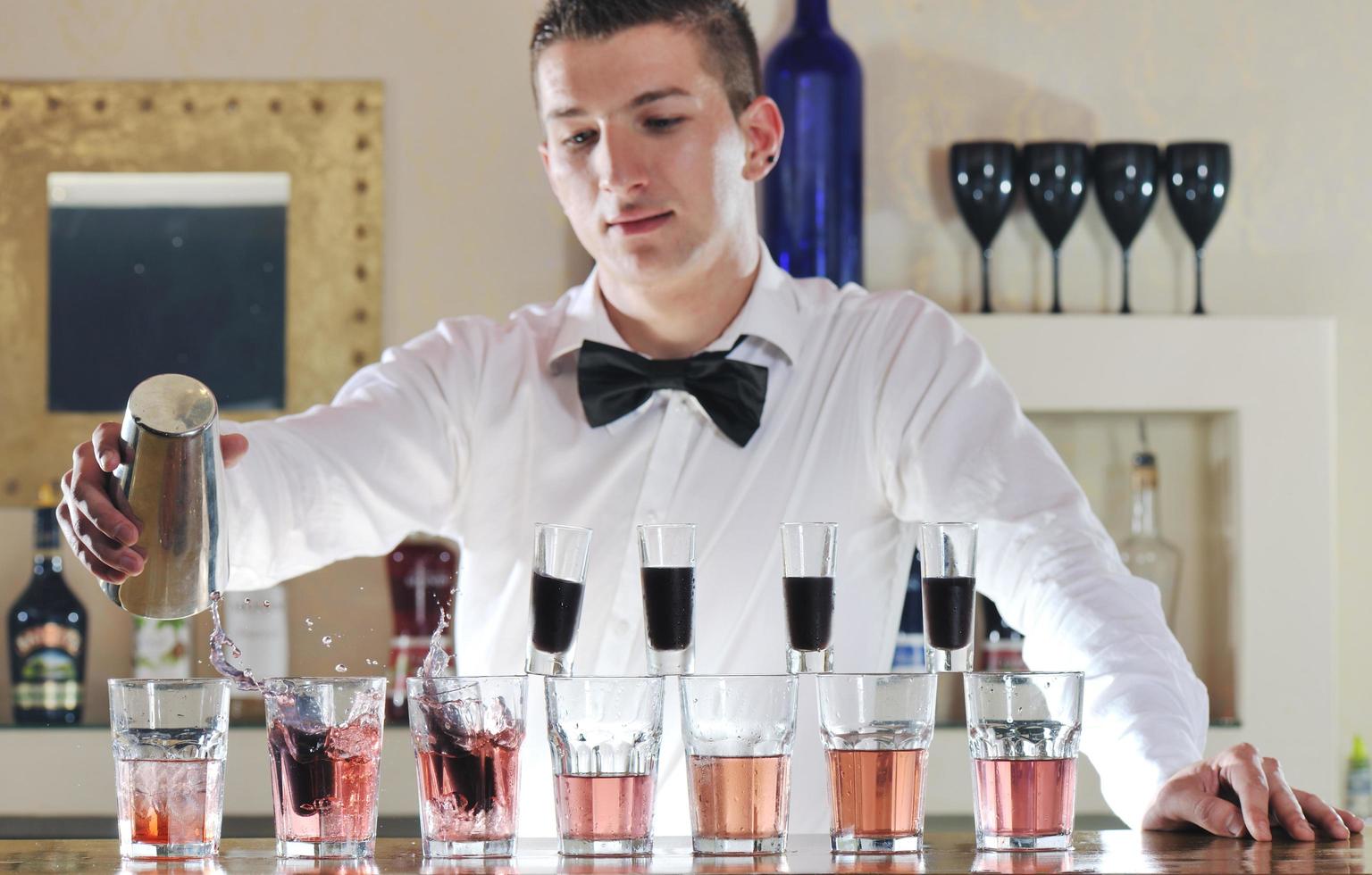pro barman prepare coctail drink on party photo