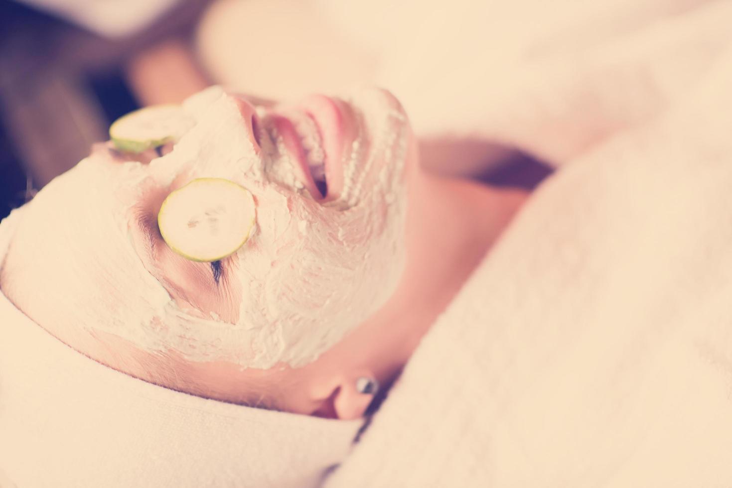 woman in spa  with cosmetic mask photo