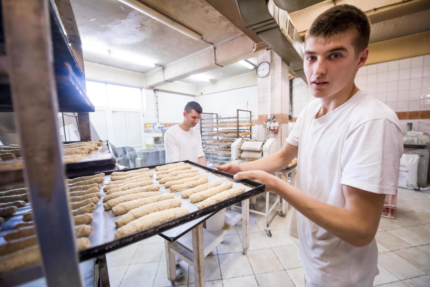 bakers preparing the dough photo