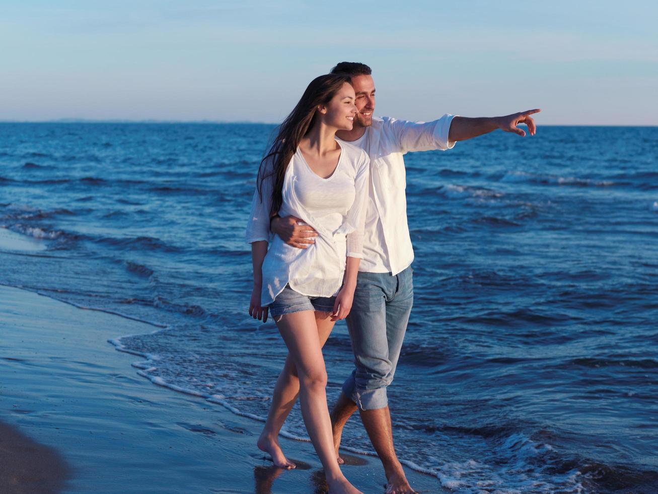 young couple  on beach have fun photo