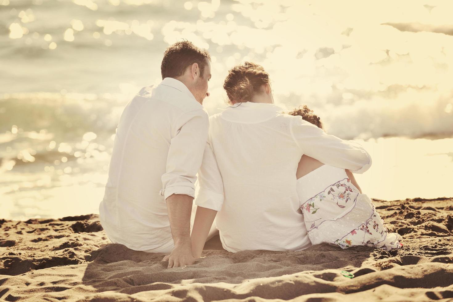 happy young  family have fun on beach photo