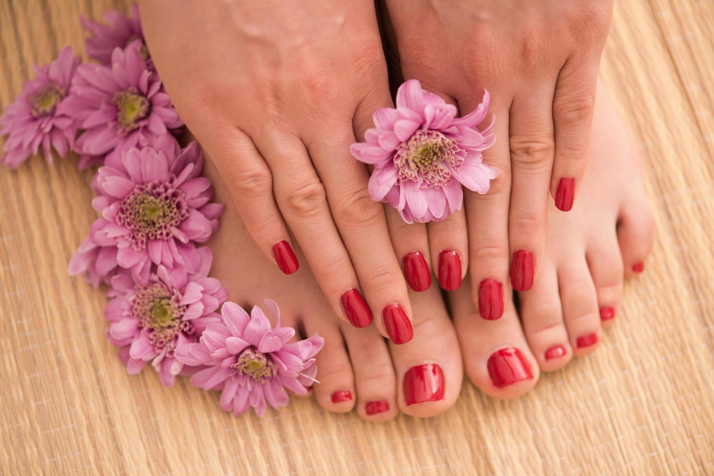 female feet and hands at spa salon photo