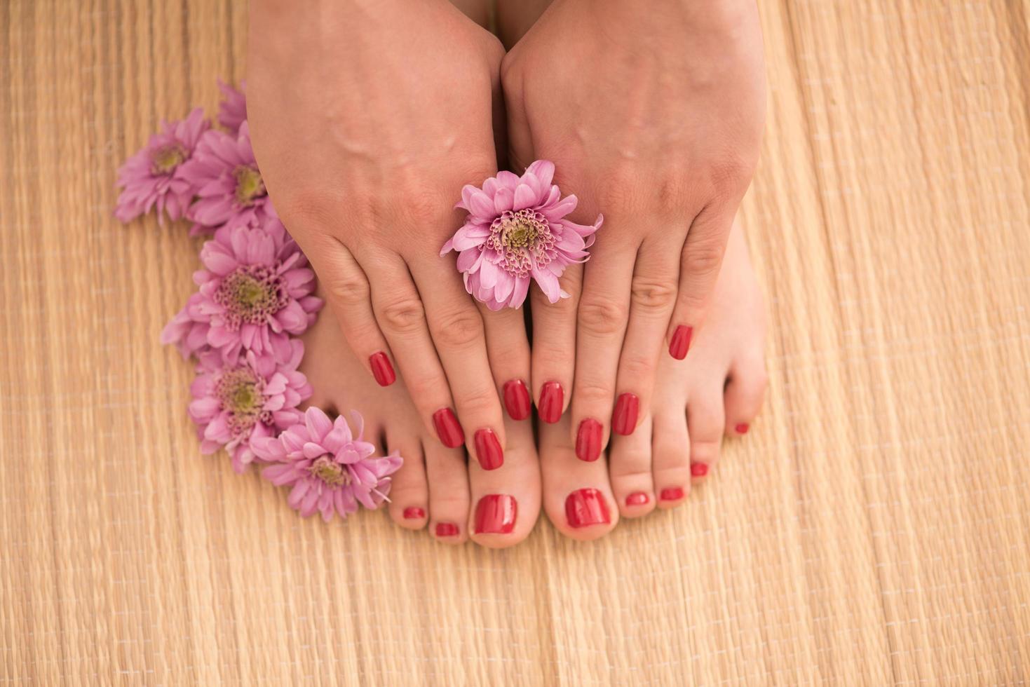 female feet and hands at spa salon photo