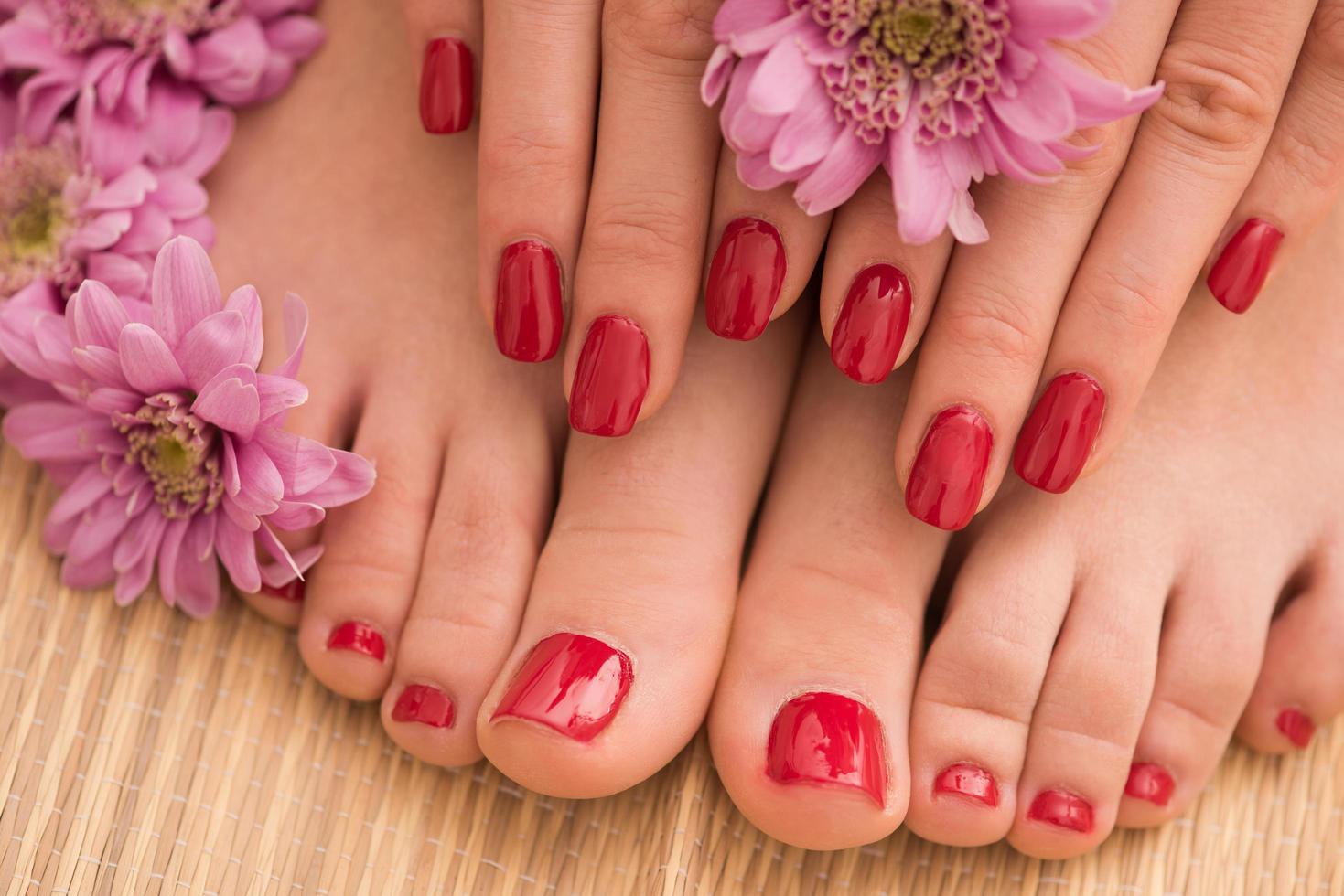 female feet and hands at spa salon photo