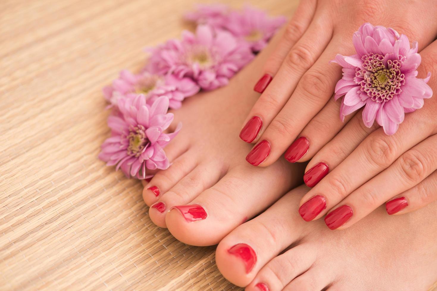 female feet and hands at spa salon photo