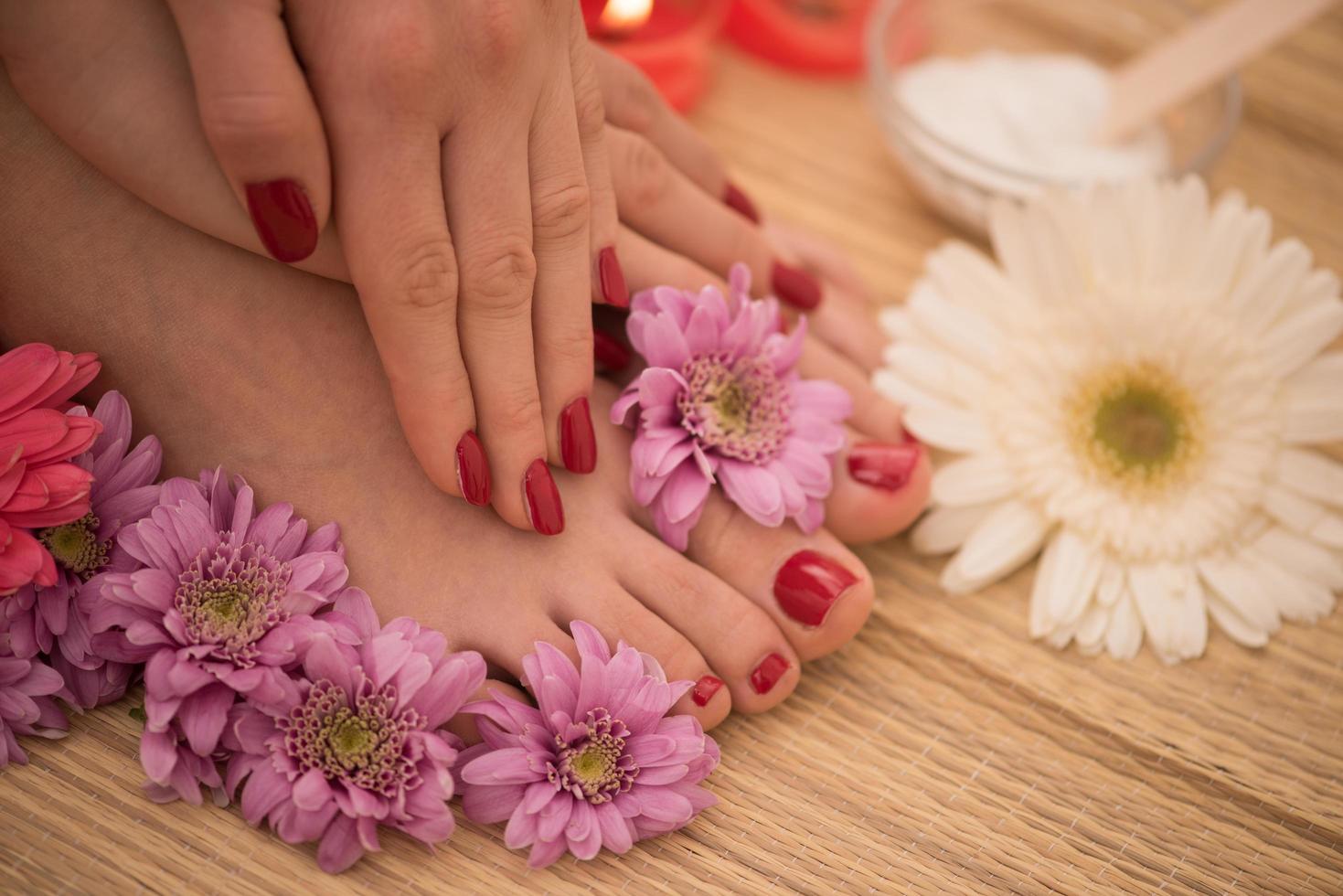 female feet and hands at spa salon photo