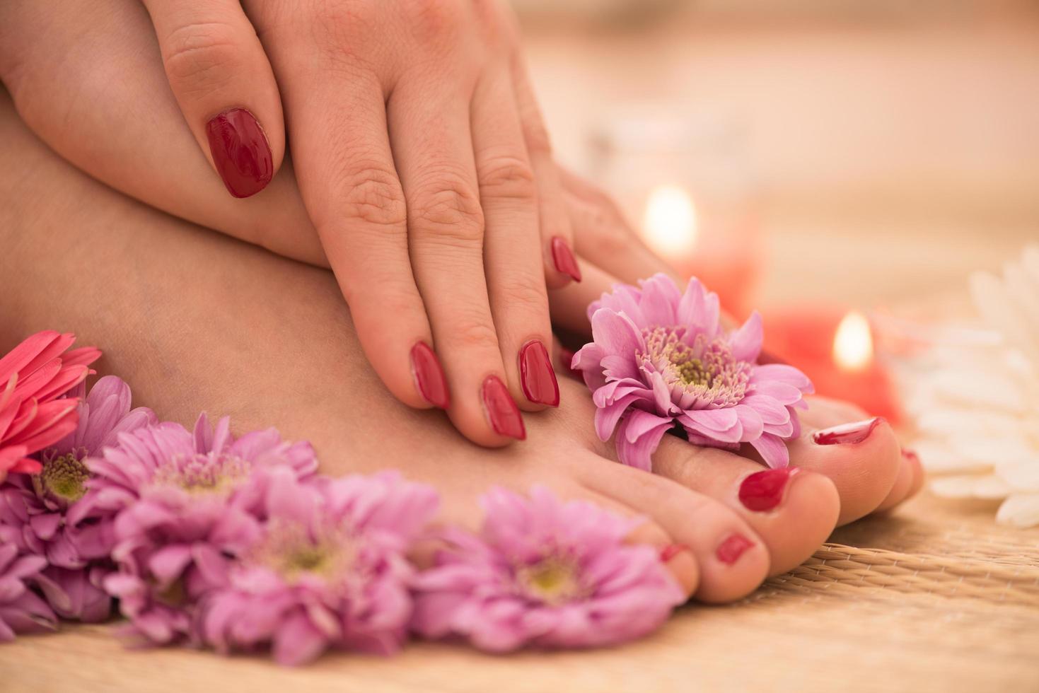 female feet and hands at spa salon photo