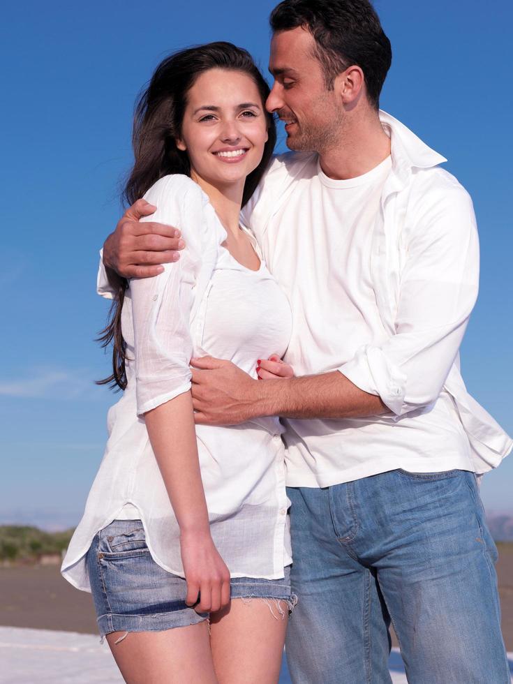 young couple  on beach have fun photo