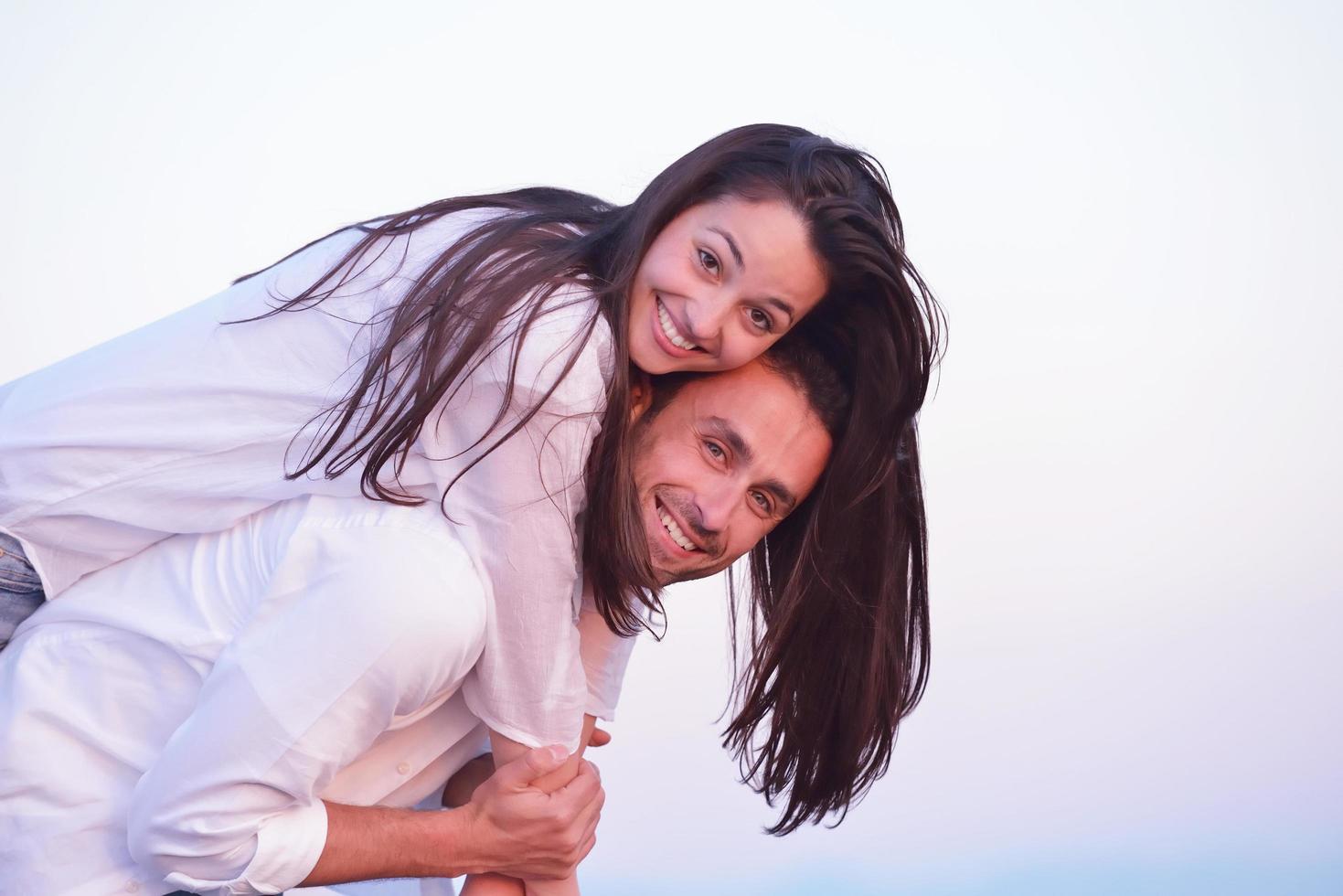 young couple  on beach have fun photo