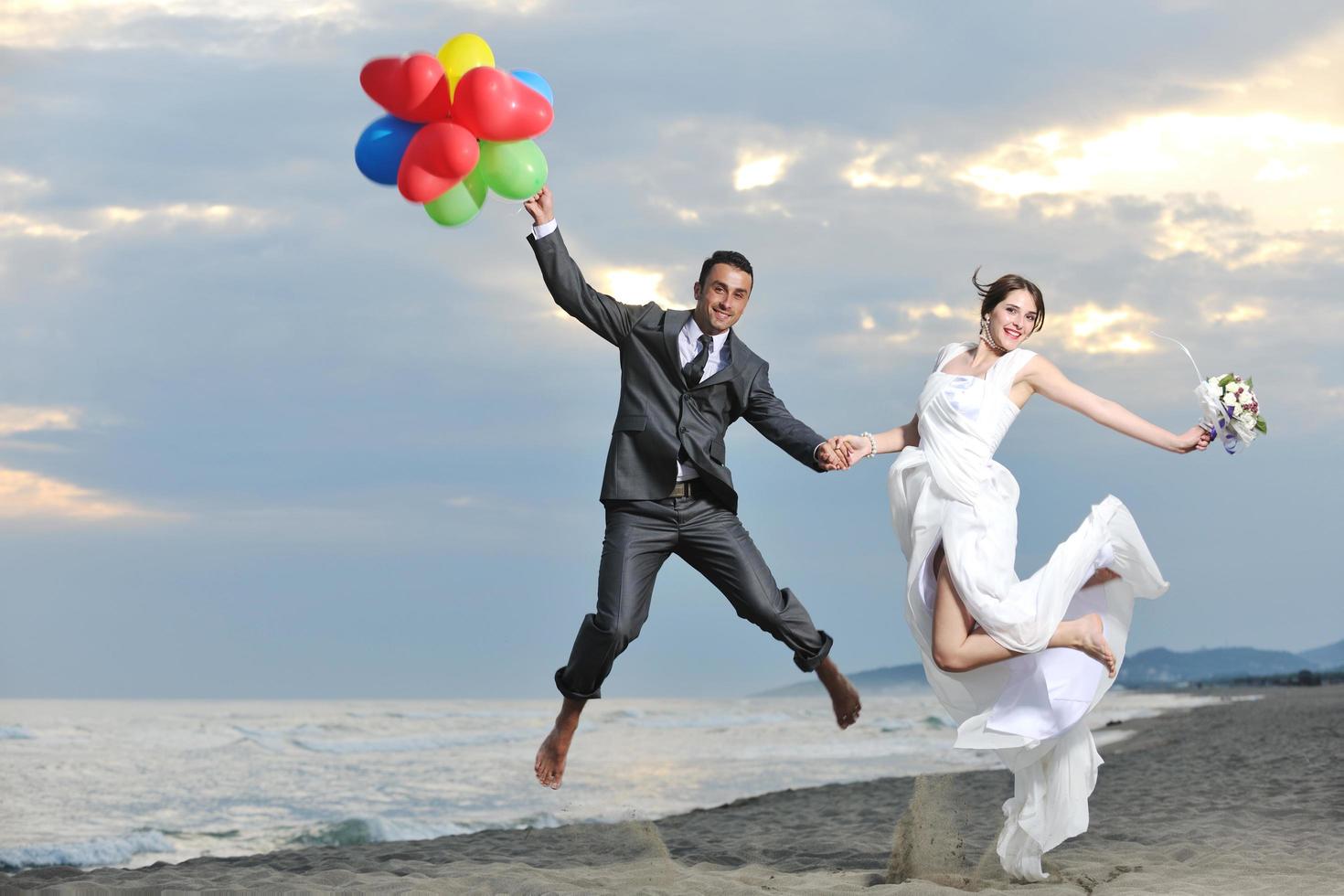 romantic beach wedding at sunset photo